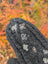 Dark gray azalea mittens knitted from zealand wool with floral embroidery and crystal centers on the back side