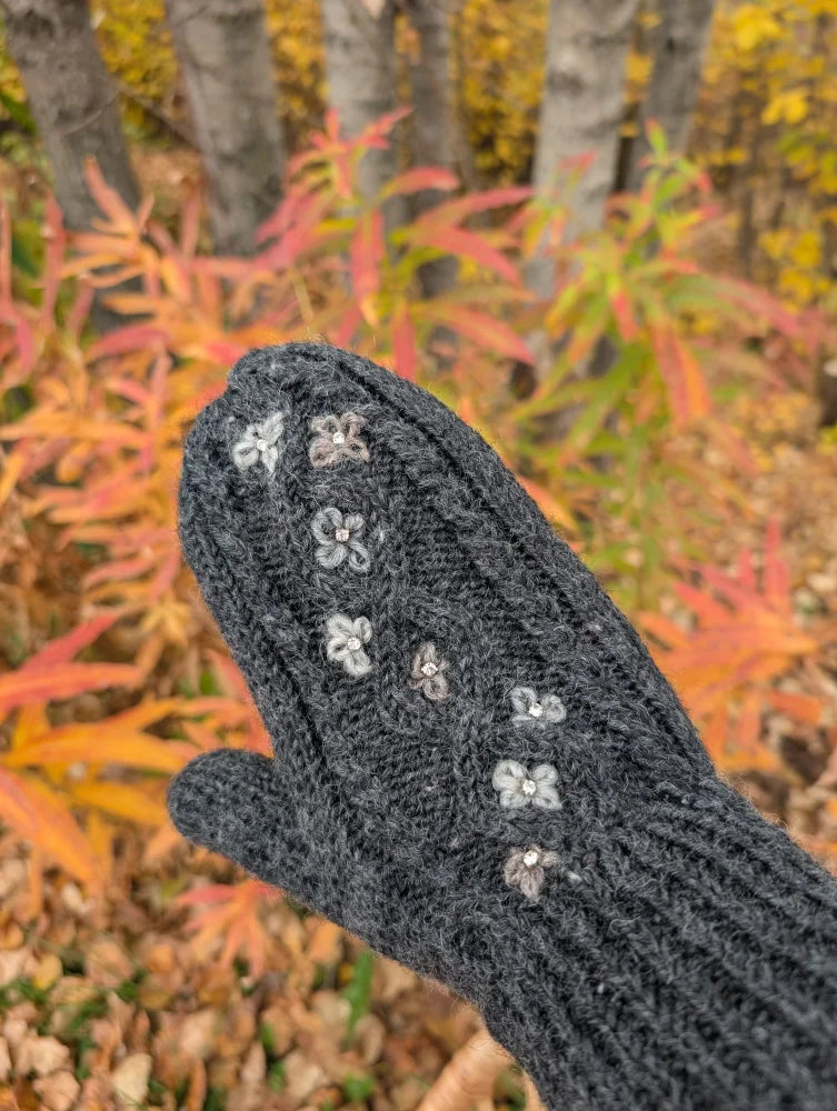Dark gray azalea mittens with delicate white floral embroidery made from cozy zealand wool