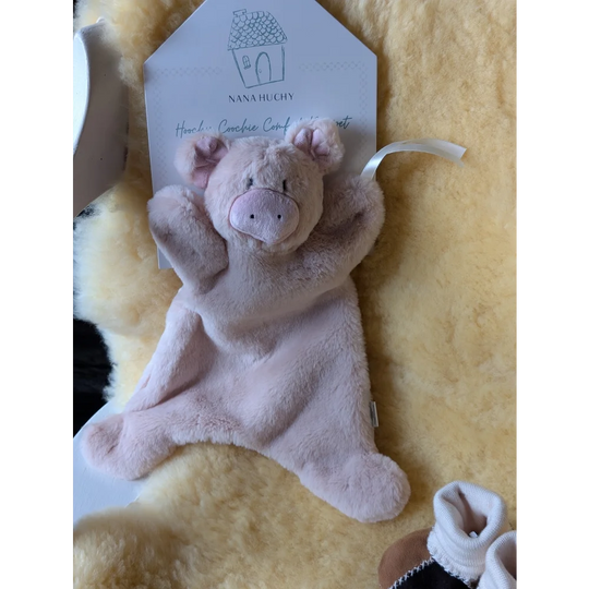 Cute plush pink pig comfort blanket with white tag, perfect for Baby Gift Set ❤️ featuring dense shearling wool