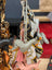 Grey dachshund bag charm by Angus Oliver with orange accents, pink tassel