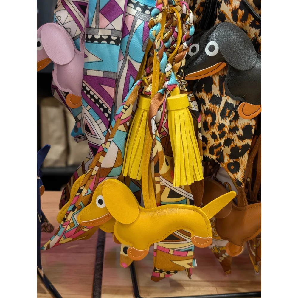 Angus Oliver yellow dachshund bag charm keychain with tassel