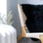 Black dyed merino sheepskins faux fur throw draped over wooden chair with woven rope backrest meeting european standards