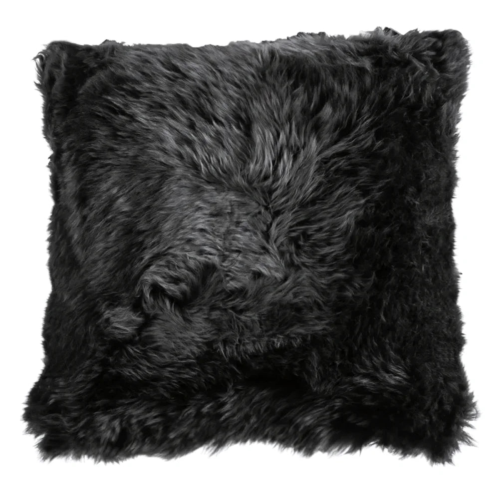 Black merino sheepskin cushion cover with plush shaggy texture cotton backs and hidden zippers in 16 or 20 inch sizes
