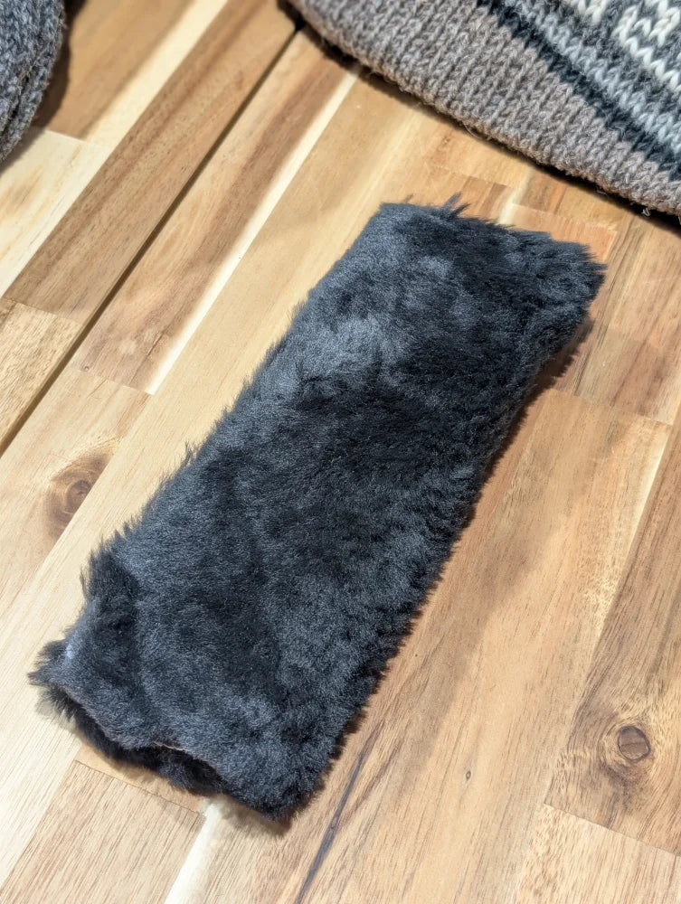 Charcoal gray faux fur headband on Angus Oliver sheepskin seat belt cover