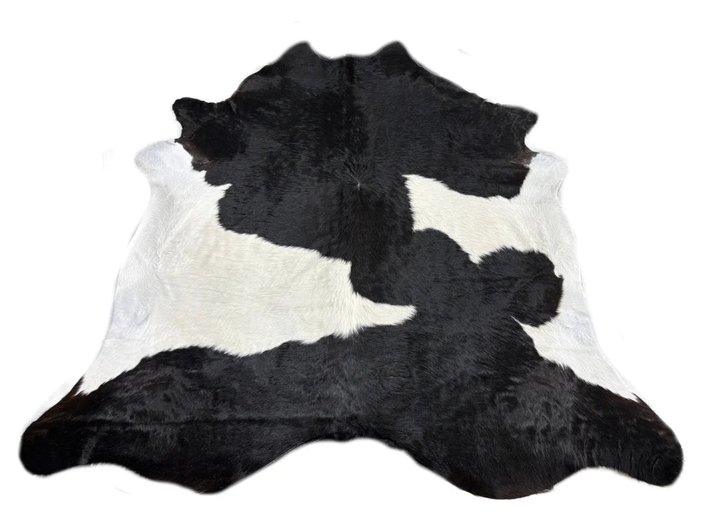 Black white large cowhide rug with natural fur texture and unique characteristics adds rustic charm arriving soon