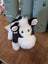 Adorable black white cow plush toy with soft fluffy fur and a giant snuggly muzzle perfect for cuddling