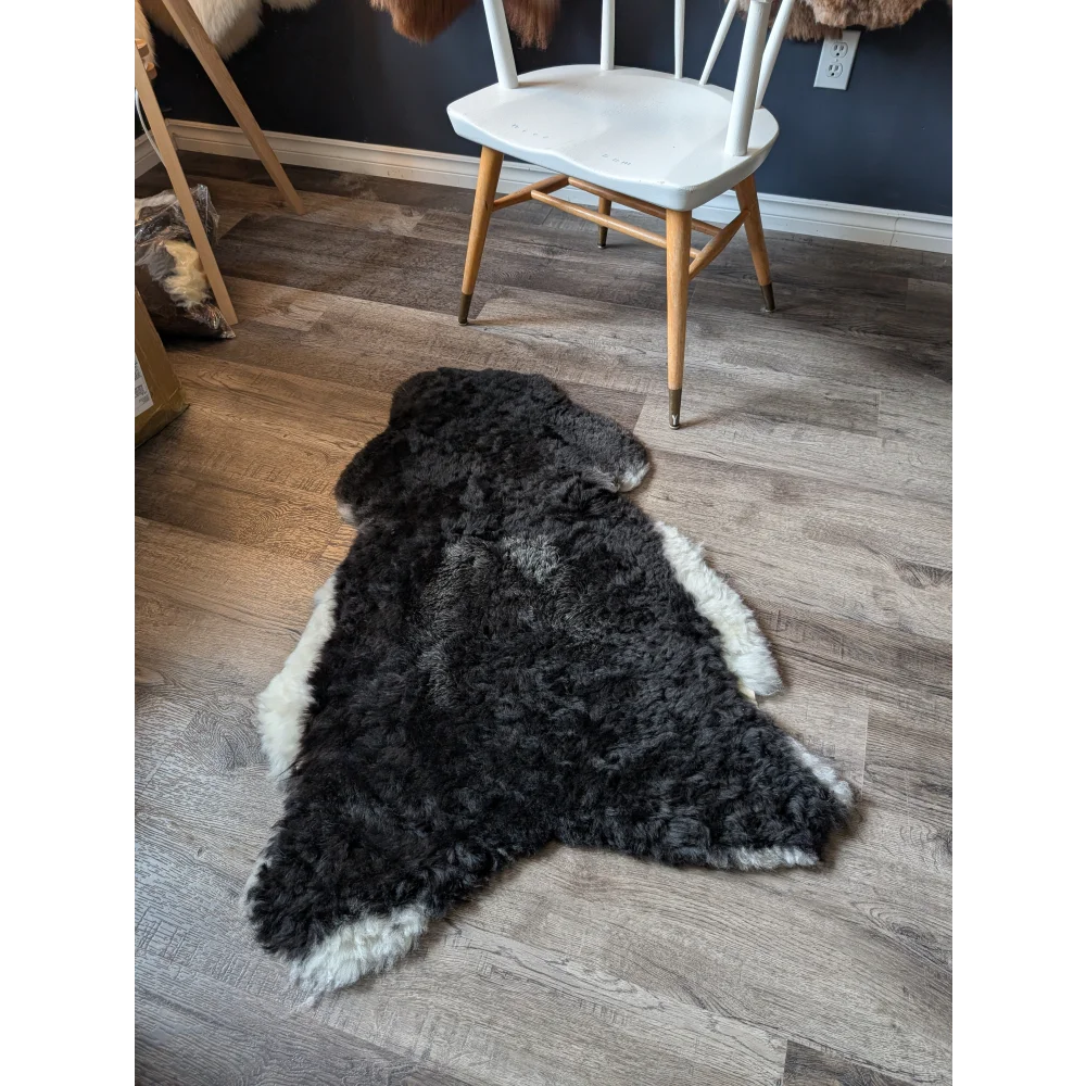 Black with white sides icelandic sheepskin rug with fluffy natural fur texture medium spotted icelandic sheepskin
