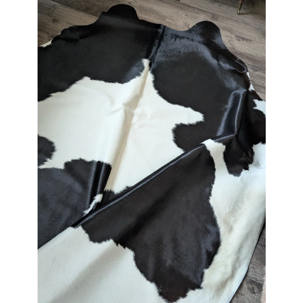 Black and white angus oliver large cowhide rug with natural irregular patches perfect for beautiful rugs lovers