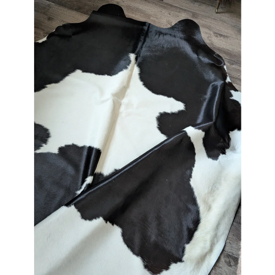 Black and white angus oliver large cowhide rug with natural irregular patches perfect for beautiful rugs lovers