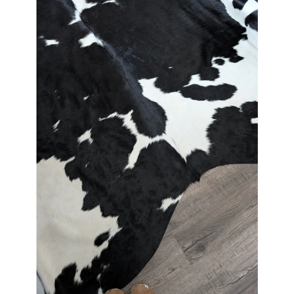 Black and white angus oliver massive cowhide rug with natural texture and unique characteristics incredibly soft underfoot