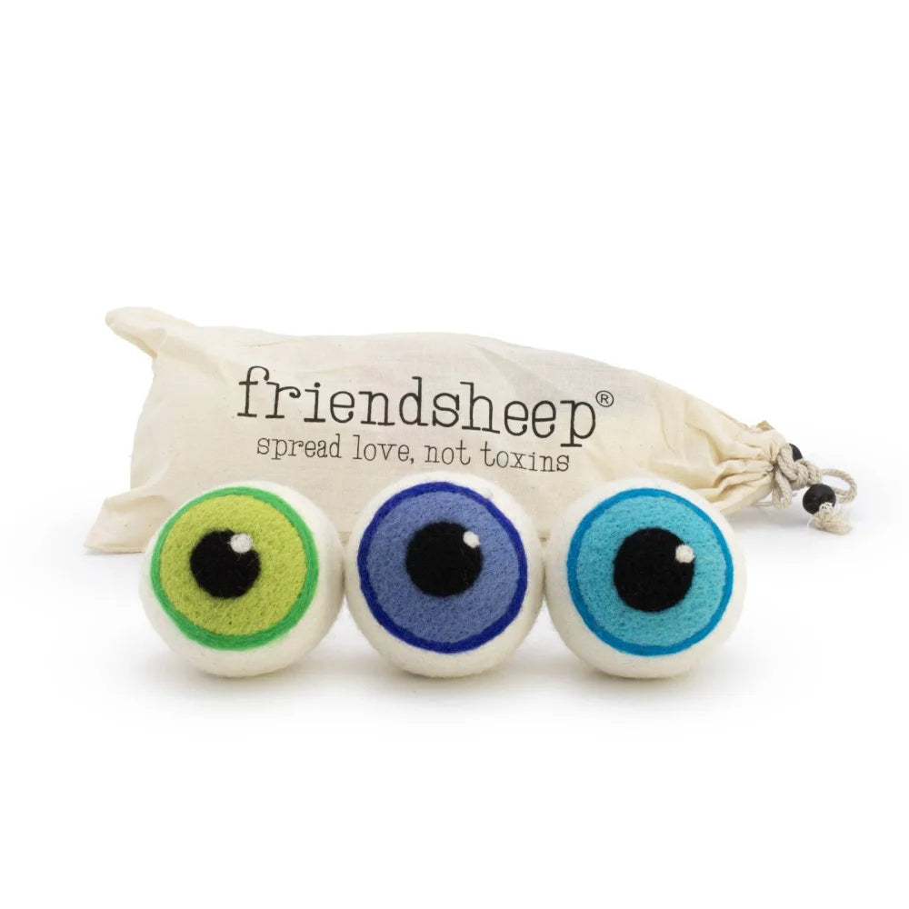 Three colorful felted wool dryer balls shaped like eerie eyeballs in green blue and light blue eco dryer set of 3