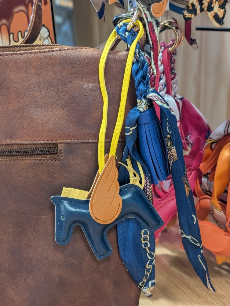 Blue winged horse scarf bag charm with tan wings and yellow strap