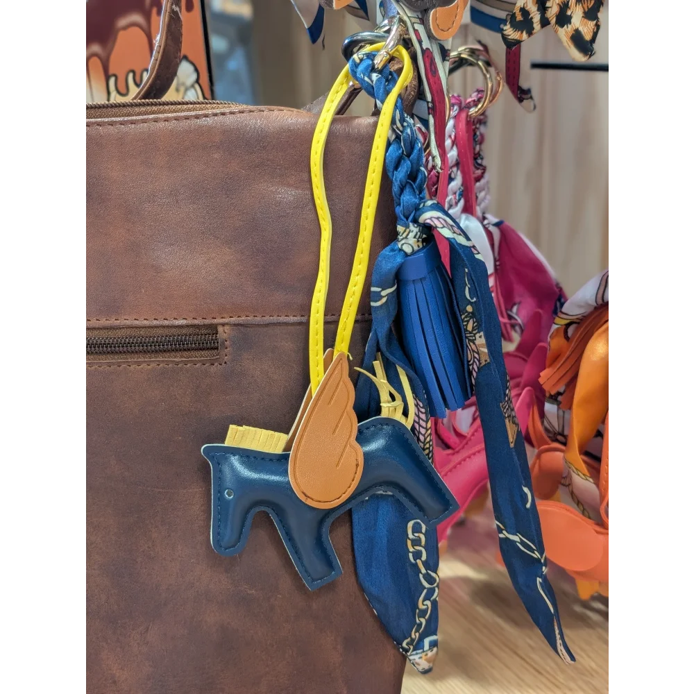 Blue winged horse scarf bag charm with tan wings and yellow strap