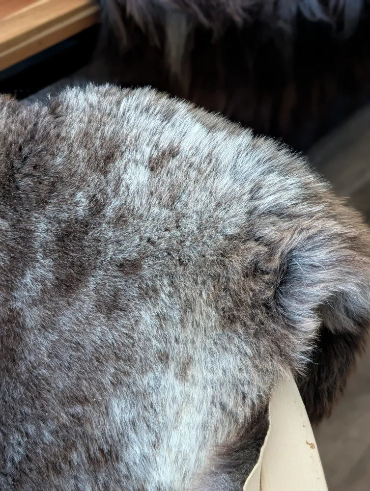 Back side of brit13 british isles sheepskin with fluffy gray and white fur in 47 by 31 inches size
