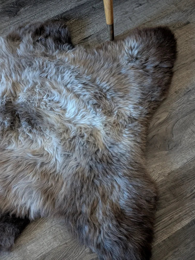 A plush british isles sheepskin rug with natural gray and white fur texture, 48 by 31 inches brit15 model