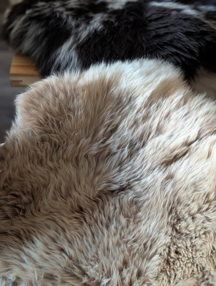 Cream-colored british isles sheepskin rug with soft fluffy texture and natural fur pile 48 by 33 inches