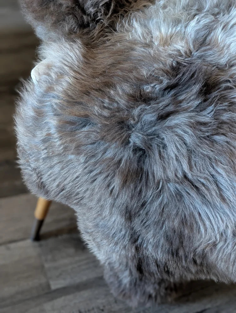 A plush gray and brown british isles sheepskin rug with soft curly texture in 49 by 29 size brit5 model