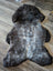 A plush british isles sheepskin rug with natural texture and a gray gradient perfect for cozy home decor