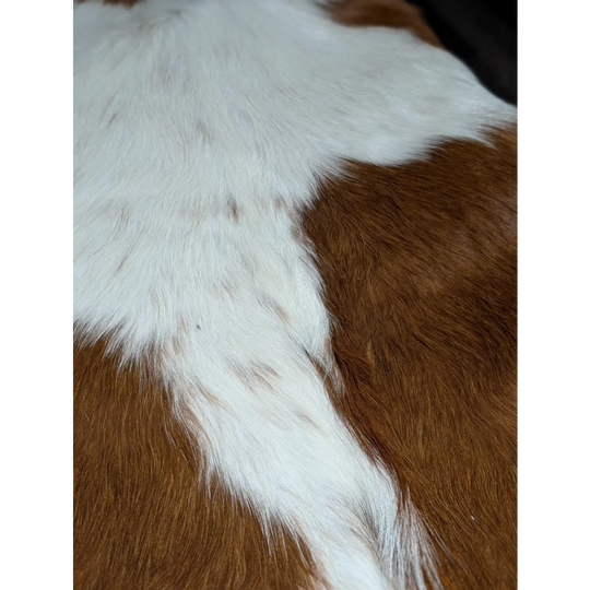 Extra large cowhide rug in brown and white, natural texture