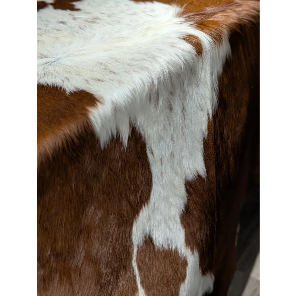 Extra large cowhide rug with brown white patches, textured surface