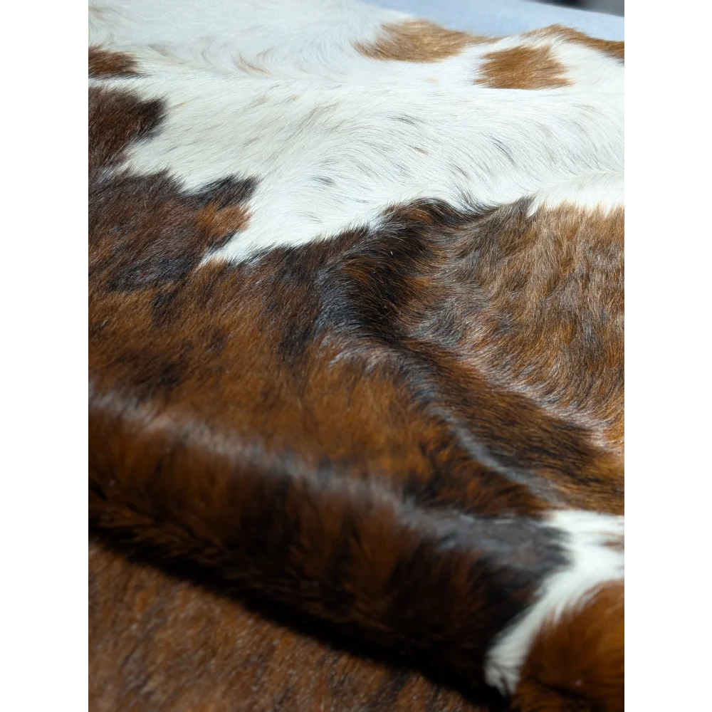 Gorgeous extra large cowhide pillow with brown white spots and soft leather texture