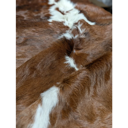 Gorgeous extra large cowhide rug in brown and white, soft underfoot with natural texture
