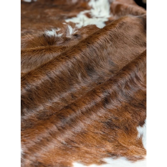 Gorgeous extra large cowhide rug in brown and white, soft underfoot with natural texture
