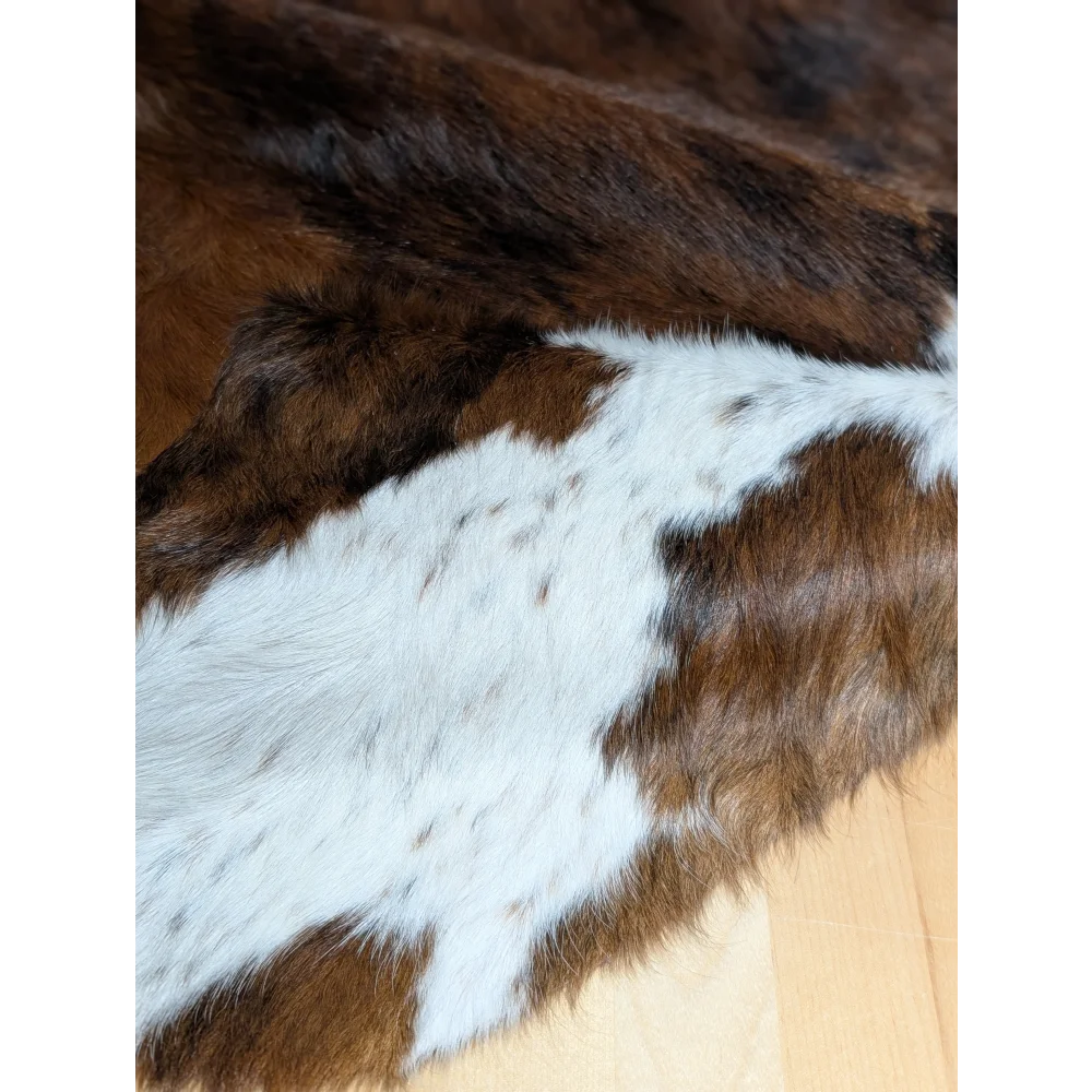 Gorgeous extra large cowhide rug in brown and white, soft underfoot with natural texture and unmistakable aura