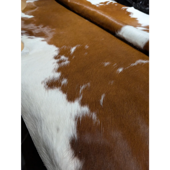 Extra large cowhide rug with brown and white patches, soft underfoot aura