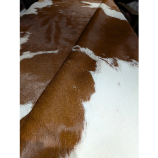 Large BRNWHT141 cowhide rug with brown white patches, soft underfoot