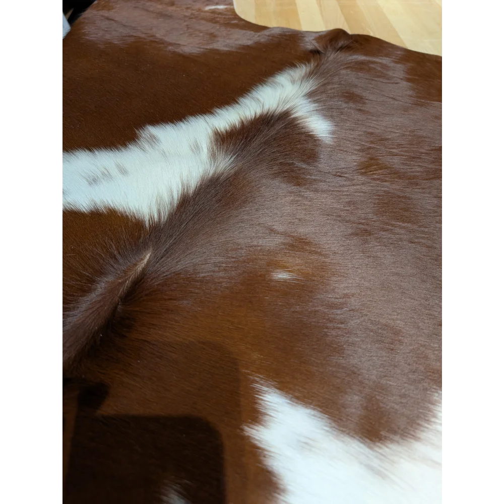 Large BRNWHT147 cowhide rug with brown white patches, soft underfoot texture