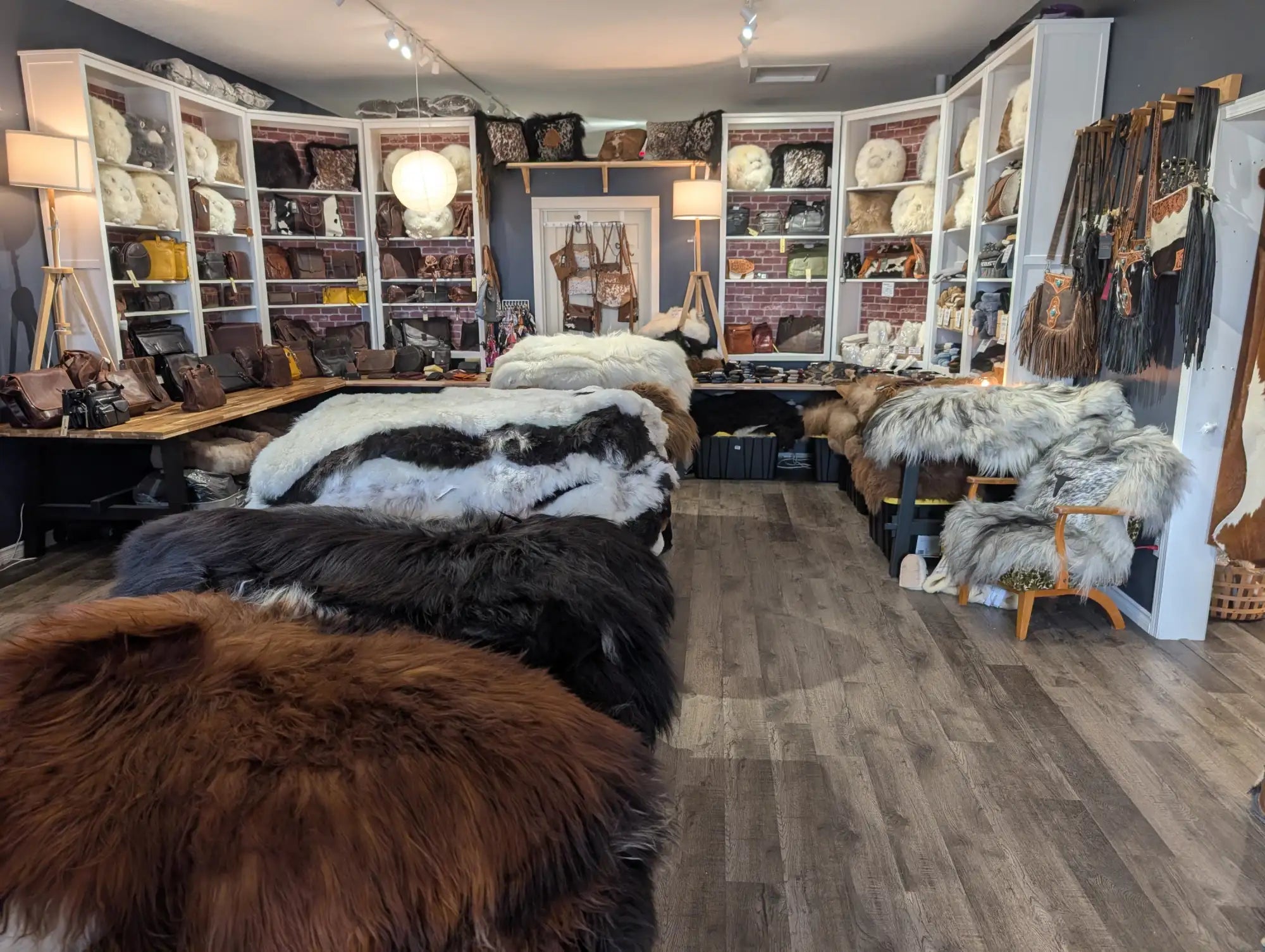 Brown, plush fur rugs displayed prominently in the foreground.