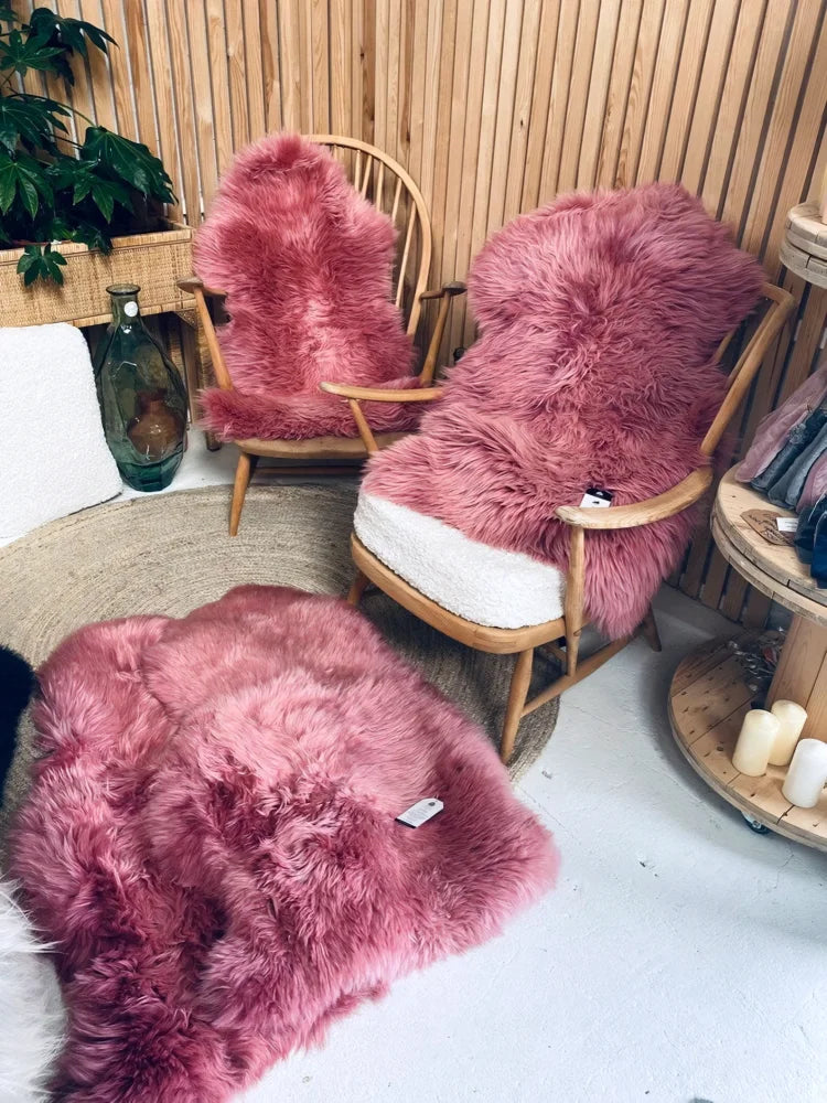 Bubblegum colour merino sheepskin rug with soft fluffy texture dusty pink and natural fur edges arriving soon