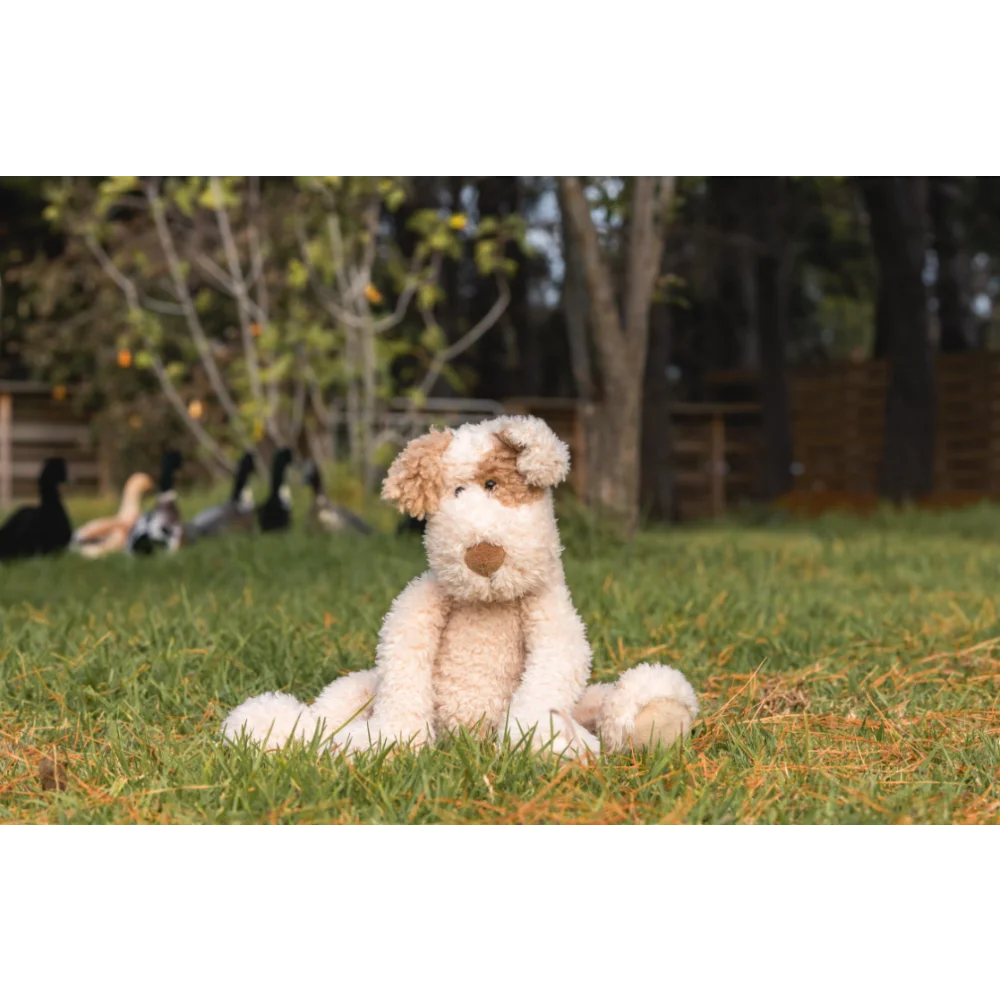 Angus Oliver plush fox pup on sheepskin rug