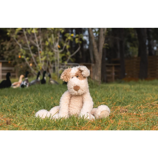 Angus Oliver plush fox pup on sheepskin rug