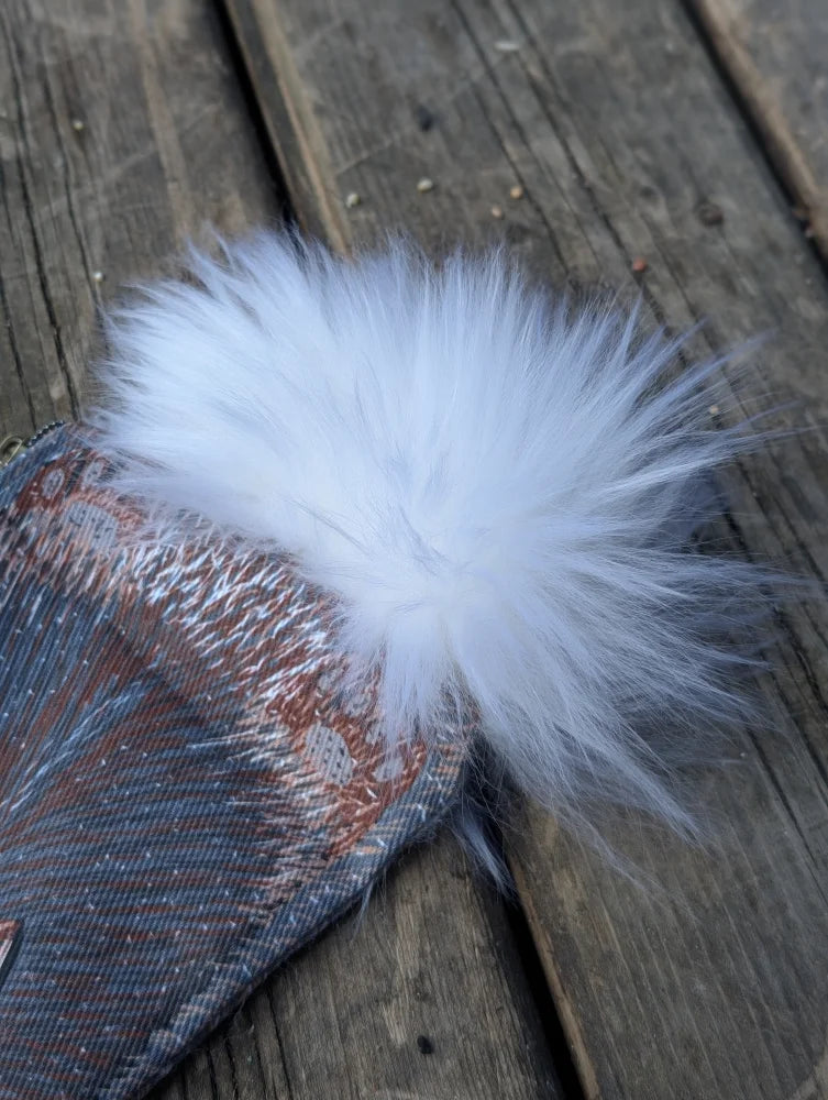 Bunny coin purse with white fluffy sheepskin tail attached to patterned cotton canvas fabric accessory