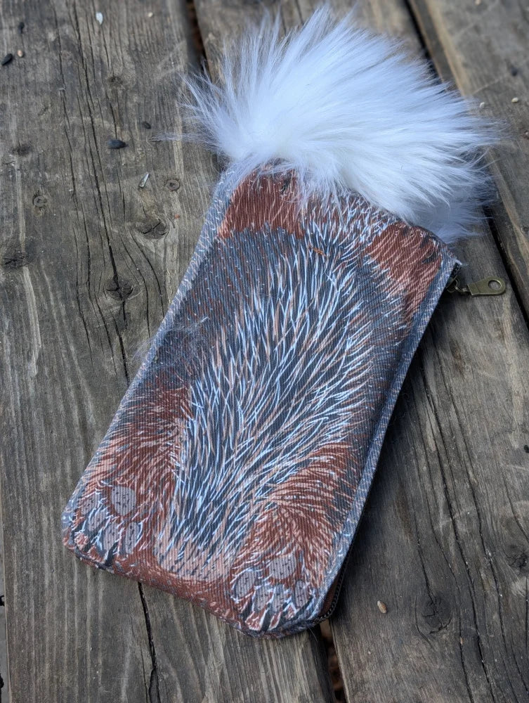 Bunny coin purse with reddish brown cotton canvas textured like fur and a fluffy white sheepskin tail pom-pom