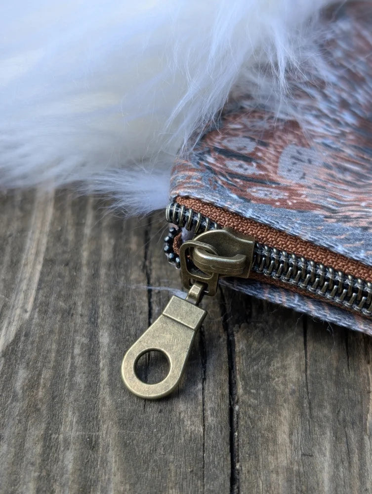 Vintage-style cotton canvas bunny coin purse with earth-toned pattern sheepskin tail and brass zipper hardware