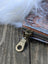 Vintage-style cotton canvas bunny coin purse with earth-toned pattern sheepskin tail and brass zipper hardware