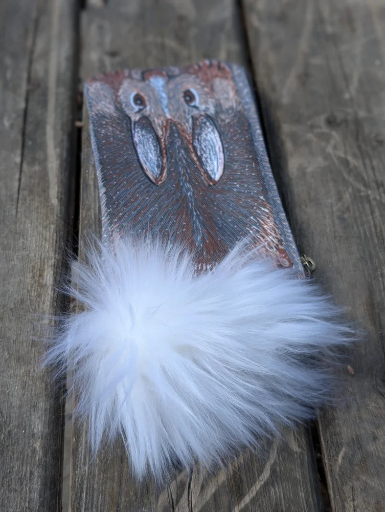 Bunny coin purse with sheepskin tail featuring rustic leather owl carving and fluffy white pom-pom detail
