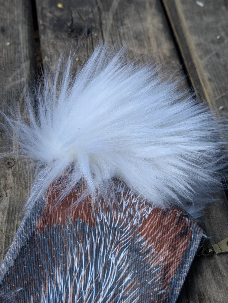 White faux fur sheepskin tail pom-pom on bunny coin purse made of cotton canvas with cute pattern