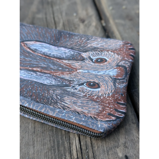 A cotton canvas bunny coin purse with sheepskin tail featuring two detailed brown and gray rabbits with expressive eyes