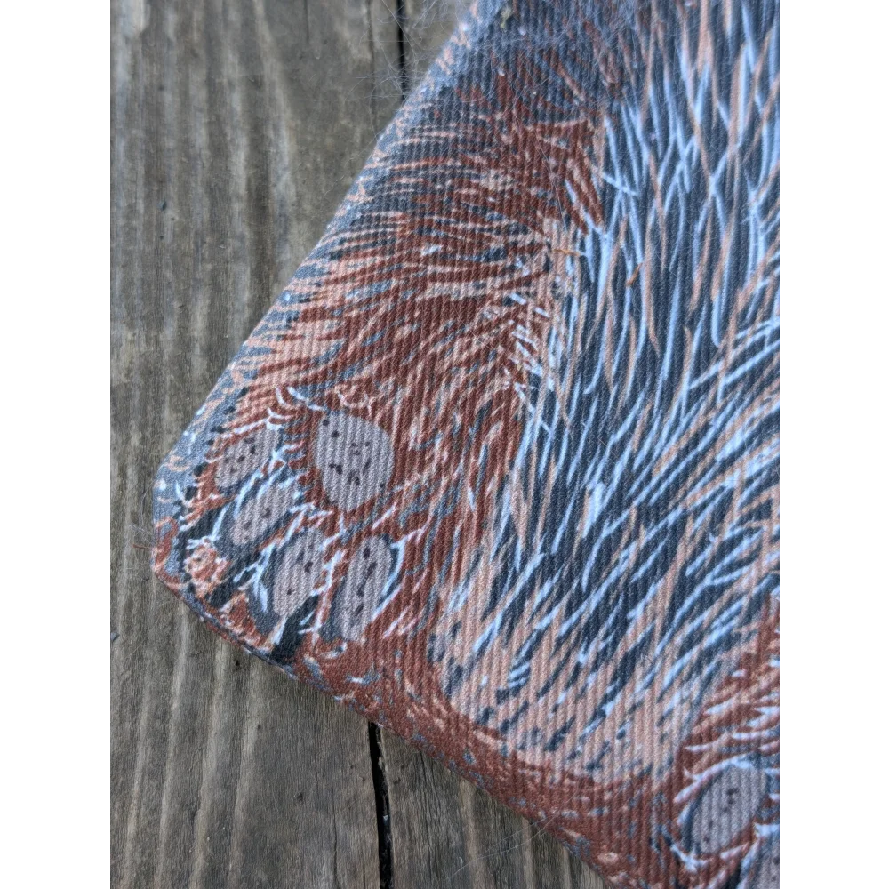 Textured cotton canvas coin purse with reddish-brown blue fur print gray paw prints and a fluffy sheepskin tail