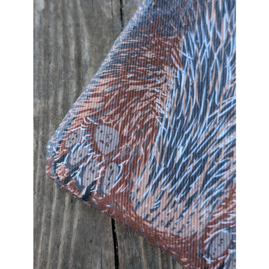 Textured cotton canvas coin purse with reddish-brown blue fur print gray paw prints and a fluffy sheepskin tail
