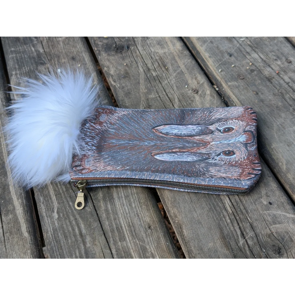 Bunny coin purse made of gray and brown cotton canvas with detailed hare design and fluffy sheepskin tail pom-pom