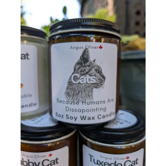 Angus Oliver disappointing candle with tuxedo cat label