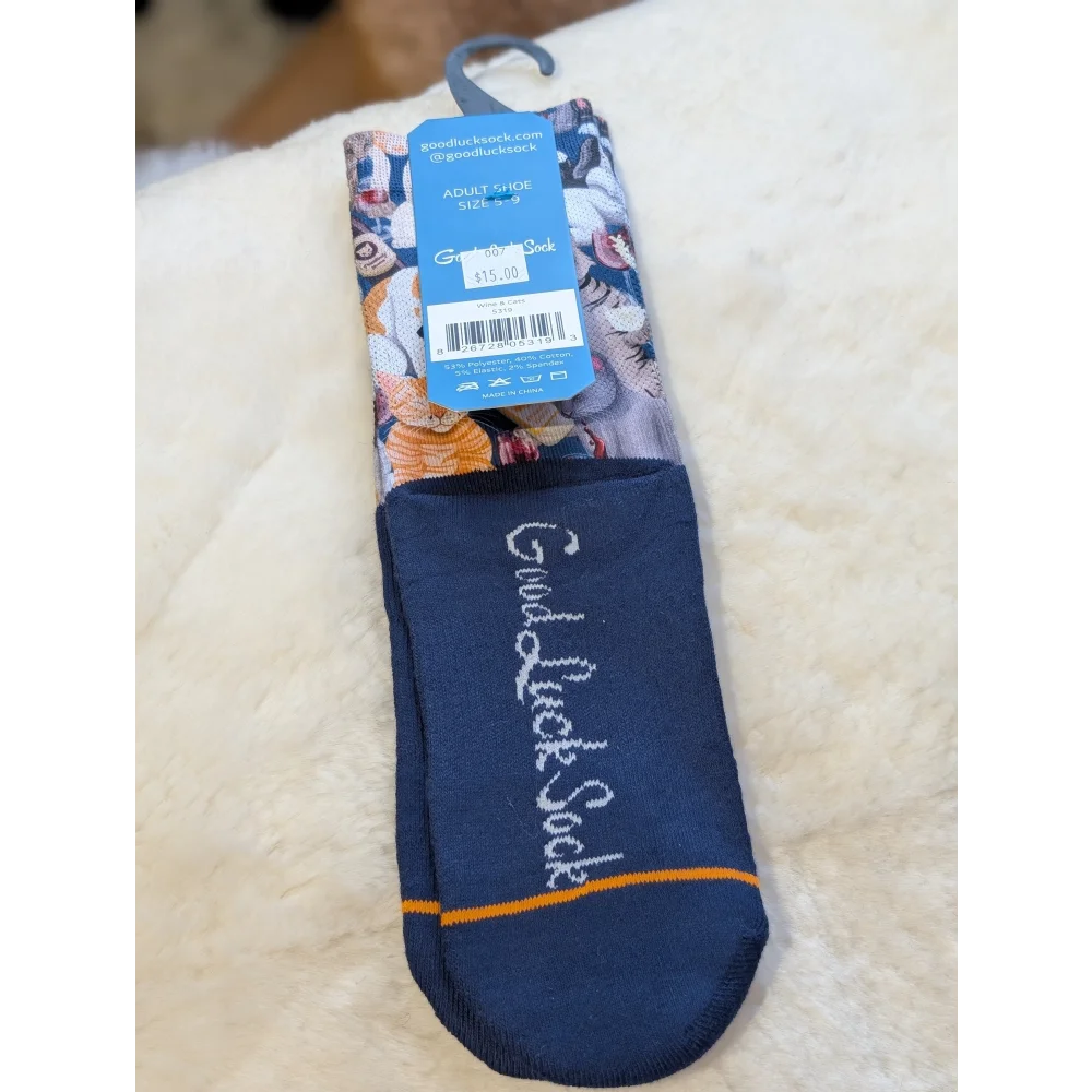 Navy blue good luck socks with orange yellow floral accents in Cats With Wine design