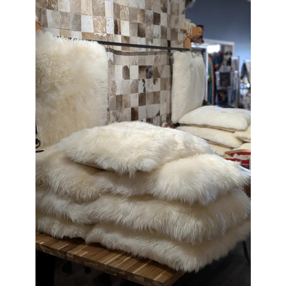 Luxurious white faux fur throw on Comfy Sheepskin Pet Bed with Canadian sheep’s wool