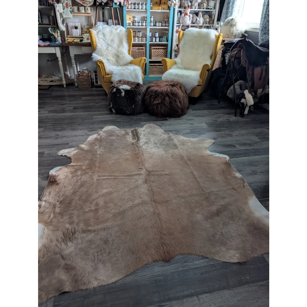 Natural brown and white large cowhide rug with soft textured fur showcasing beautiful rugs and unique characteristics