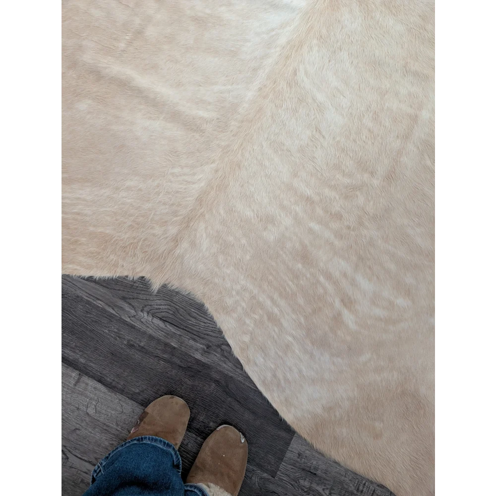 Beige faux fur large cowhide rug with soft plush texture and unique characteristics for beautiful rugs decor